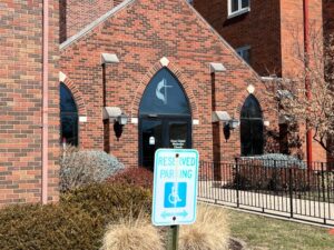 Handicap-accessible parking space sign at Grace United Methodist Church.